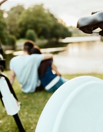 couple-sitting-in-park-with-bicycles-in-foreground-2026-01-05-05-05-09-utc (1)